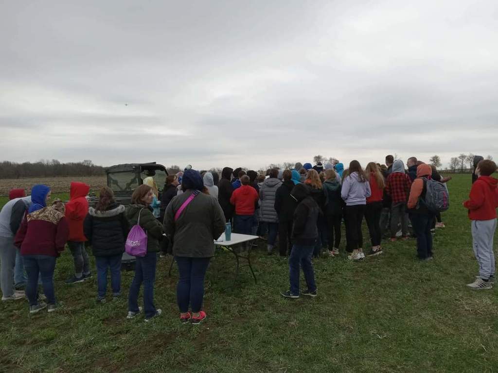 Students watched a local farmer fly and explain how he uses a drone.